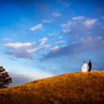 Sanctuary Wedding - Bride and Groom on hill in Sedalia, CO