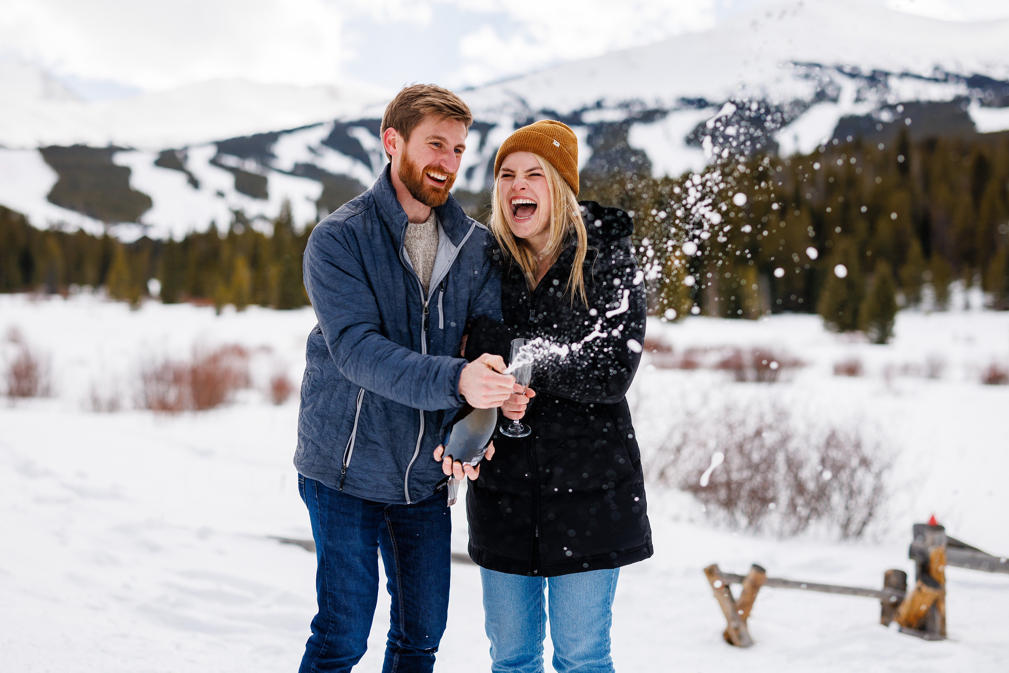 After saying yes to Zac, these two pop a bottle of champagne in celebration of their proposal.